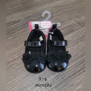 Black baby sandals.
